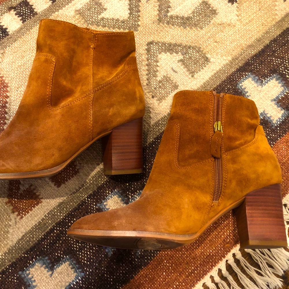 Modern suede boots in dark mustard yellow